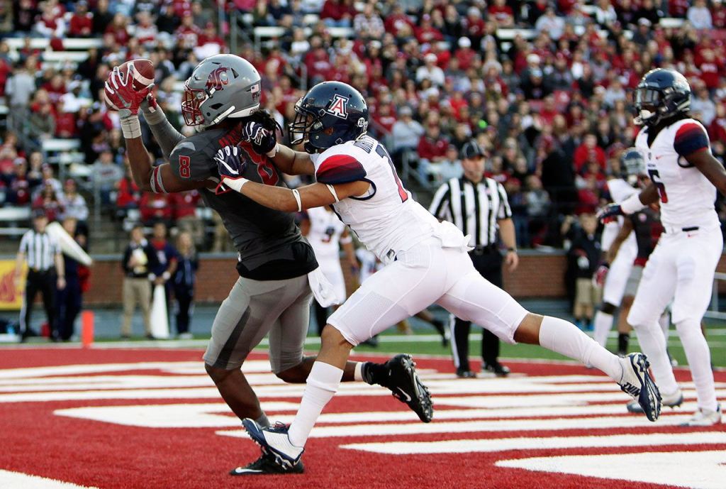 Young Kwak / Associated Press                                Washington State wide receiver Tavares Martin Jr. (8) catches a pass for a touchdown while defended by Arizona cornerback Jace Whittaker during the second half of Saturday&rsquo;s game.