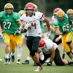 Archbishop Murphy&rsquo;s Anfernee Gurley (center) sprints down field for a 35-yard touchdown reception during a Class 2A state playoff game against Tumwater on Nov. 19. (Ian Terry / The Herald)
