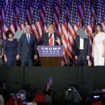 Surrounded by his family and Vice-President-elect Mike Pence and his family, President-elect Donald Trump gives his acceptance speech during an election-night rally early Wednesday in New York. (AP Photo/John Locher)