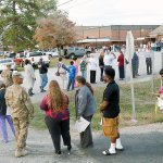 People stand in a long line to vote at the Smiths Station Jr High polling place in Smiths Station, Alabama, on Tuesday. (Todd J. Van Emst/Opelika-Auburn News via AP)