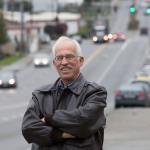 Dennis Morris stands along E. Marine View Drive, where the Everett Sail and Power Squadron clean up garbage four times year, on Tuesday in Everett. (Andy Bronson / The Herald)