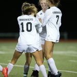 Jackson&rsquo;s Rikki Myers (facing) is surrounded by teammates after scoring a goal as Jackson beat Union 2-1 in a first-round 4A state playoff game Tuesday night at Everett Memorial Stadium. (Andy Bronson / The Herald)