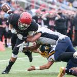 Archbishop Murphy&rsquo;s Collin Montez fumbles the ball out of bound forced by Burlington-Edison&rsquo;s Terrel Cameron, top, and Brett Rawlins Saturday afternoon at Terry Ennis Stadium on November 5, 2016. (Kevin Clark / The Herald)