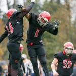 Archbishop Murphy&rsquo;s Anfernee Gurley, left, and Kyler Gordon celebrates a touchdown Saturday afternoon against Burlington-Edison at Terry Ennis Stadium on November 5, 2016. (Kevin Clark / The Herald)