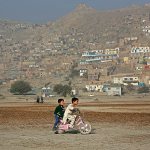 Haseebullah 7, rides his bicycle with a friend on the outskirts of Kabul, Afghanistan, on Thursday, Nov. 3. (AP Photo/Rahmat Gul)