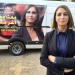 In this photo taken Sept. 29, 2016, politician Nabila Mounib, 56, poses for a photo in front of her campaign bus in the central Moroccan town of Missour. Mounib, leader of the Federation of the Democratic Left, is the country&rsquo;s most high-profile female politician and is seen as a trailblazer in a region where men still dominate politics. (AP Photo/Karin Laub)