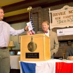 The town&rsquo;s first voter, Clay Smith, drops his ballot into the box as moderator Tom Tillotson watches on Tuesday in Dixville Notch, New Hampshire. Democratic candidate Hillary Clinton beat Republican Donald Trump 4-2 there. (AP Photo/Jim Cole)