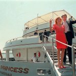 In this July 4, 1998, photo, Donald Trump waves to reporters with his then wife, Ivana, as they board their yacht &ldquo;The Trump Princess&rdquo; in New York. (AP Photo/Marty Lederhandler, File)