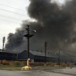 Smoke billows from the site ofa massive blaze at the former Bethlehem Steel Mill in Lackawanna, New York, on Wednesday, Nov. 9. The flames have since diminished, but smoke is visible for miles. No injuries were reported. (AP Photo/Carolyn Thompson)