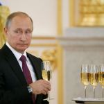 Russian President Vladimir Putin holds a glass during a ceremony of receiving diplomatic credentials from foreign ambassadors in the Kremlin in Moscow, Russia, on Wednesday. Putin says that Moscow is ready to try to restore good relations with the United States in the wake of the election of Donald Trump. (Sergei Karpukhin/Pool photo via AP)