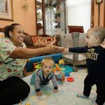 In this Oct. 20 photo, Nancy Harvey, owner of Lil&rsquo; Nancy&rsquo;s Primary Schoolhouse, cares for toddlers at her home, which has she has converted into a child care center, in Oakland, California. Most U.S. households are heading for a worse lifestyle in retirement than they had while they were working, because they simply aren&rsquo;t saving enough, experts say. Harvey, who has less than $2,000 saved despite her decades of work, plans to continue with real-estate classes in hopes that it can provide a second job. (AP Photo/Marcio Jose Sanchez)