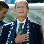 Seattle Sounders newly named head coach Brian Schmetzer stands during the singing of the national anthem before an MLS soccer match against Real Salt Lake, in Seattle, on Oct 23. (AP Photo/Ted S. Warren, file)