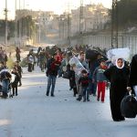 In this Nov. 27 photo, people flee rebel-held eastern neighborhoods of Aleppo into the Sheikh Maqsoud area that is controlled by Kurdish fighters,in Syria. With Syria&rsquo;s Russian-backed military appearing close to seizing total control of Aleppo, U.S. officials concede they have little to no chance of securing a diplomatic breakthrough to halt the civil war in President Barack Obama&rsquo;s last weeks in office. (The Rumaf via AP)