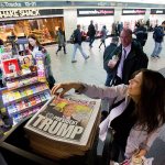 A woman reaches for a New York Post newspaper featuring president-elect Donald Trump&rsquo;s victory Wednesday in New York. (AP Photo/Mark Lennihan)