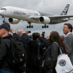 An Airbus A350 aircraft lands at the Farnborough International Airshow in Farnborough, United Kingdom, in July. (Luke MacGregor / Bloomberg)