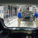 In this Jan. 26, 2016, photo, workers assemble a car during a press tour at the plant of the German car manufacturer Volkswagen Sachsen in Zwickau, Germany. (AP Photo/Jens Meyer, file)