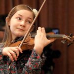 Alma Deutscher plays violin during a rehearsal in Vienna, Austria, on Thursday. (AP Photo/Ronald Zak)