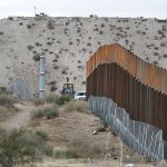 Workers continue work raising a taller fence in the Mexico-U.S. border area separating the towns of Anapra, Mexico, and Sunland Park, New Mexico, on Thursday, Nov. 10. An Arizona Native American tribe has said it will not support the building of a wall on their land. (AP Photo/Christian Torres)