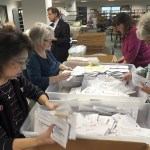 Election workers sort through early ballots in Salem, Oregon, on Monday, Nov. 7, in the Marion County clerks office. (AP Photo/Andrew Selsky)