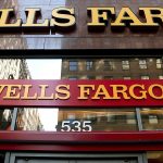 In this 2012 photo, a Wells Fargo sign is displayed at a branch in New York. (AP Photo/CX Matiash, File)