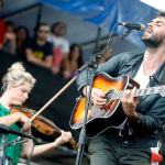 Charity Rose Thielen and Jonathan Russell of The Head & The Heart perform at the Newport Folk Festival in Newport, Rhode Island, on July 29, 2012. The group will headline three shows Nov. 5-7 at the Paramount Theatre. (AP Photo/Joe Giblin)