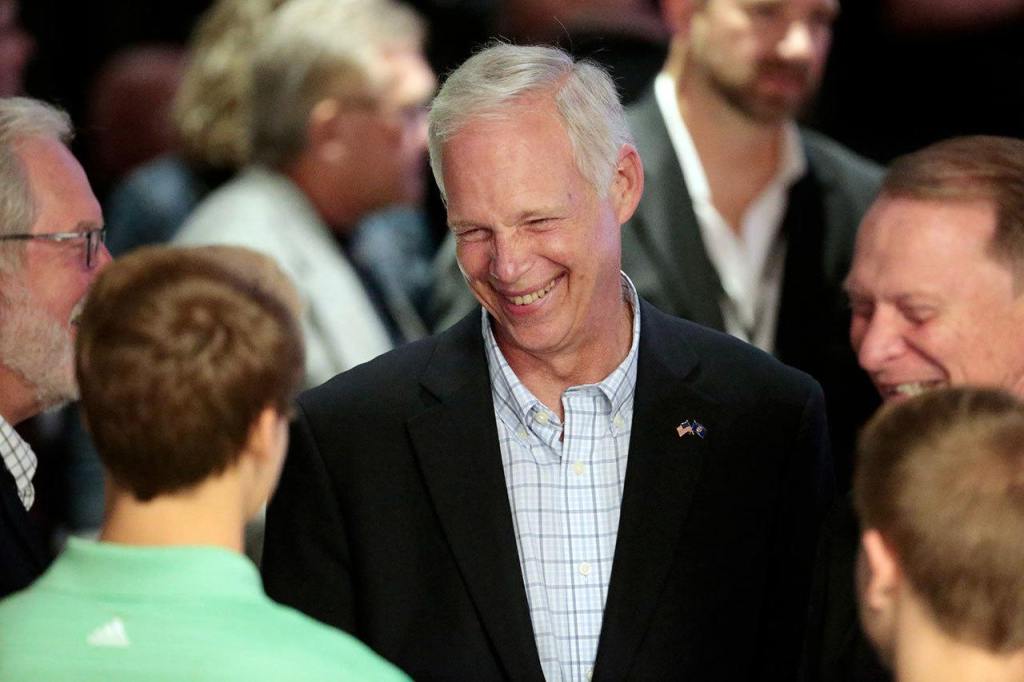 U.S. Sen. Ron Johnson, R-Wis., visits with supporters at his Election Night party at the Oshkosh Convention Center in Oshkosh, Wisconsin, on Tuesday, Nov. 8. (Michael P. King/Wisconsin State Journal via AP)