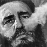 March 1985: Cuba&rsquo;s leader Fidel Castro exhales cigar smoke during an interview at the presidential palace in Havana, Cuba. (AP Photo/Charles Tasnadi, File)