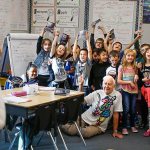 Kiwanis Club volunteers Jack Lapoint (center floor) and James Henry (right) pose with third-graders for teacher Christi Castro to photograph after giving the kids new dictionaries from the Kiwanis Club for the last time. (Dan Bates / The Herald)