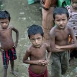 In this 2014 photo, Rohingya children gather at the Dar Paing camp for Muslim refugees, north of Sittwe, western Rakhine state, Myanmar. (AP Photo/ Gemunu Amarasinghe, File)