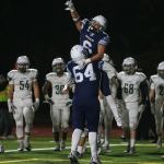 Meadowdale&rsquo;s Kela Marshall (6) celebrates a touchdown with teammate Bryce Chapman during a 3A state quarterfinal game against Peninsula on Friday at Edmonds Stadium. (Kevin Clark / The Herald)