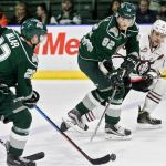 Everett&rsquo;s Graham Millar (left) receives a pass from Eetu Tuulola with Red Deer&rsquo;s Evan Polei defending during a game Wednesday night at Xfinity Arena in Everett. (Kevin Clark / The Herald)