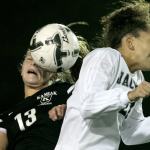 Kamiak&rsquo;s Hunter Beirne (left) and Jackson&rsquo;s Jadyn Edwards battle for a header during a district playoff match Thursday night Everett Memorial Stadium. (Kevin Clark / The Herald)