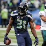 Seahawks safety Kam Chancellor celebrates his intereception with Eagles wide receiver Bryce Treggs making his back to the bench Sunday afternoon at Century Link Field in Seattle on November 20, 2016. Seahawks won 26-15. (Kevin Clark / The Herald)