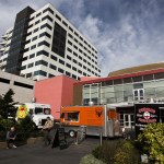 Food trucks (from left) Yummy Box, The Vet Chef and Cathouse Pizza share a space near the Everett Performing Arts Center in downtown Everett on Friday. (Ian Terry / The Herald)