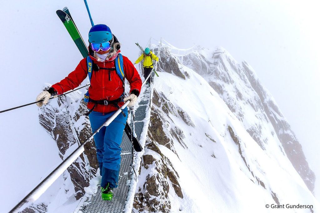 Grete Eliassen and Jess McMillan cross a footbridge at Andermatt in Switzerland. (Photo courtesy Warren Miller Enterainment)