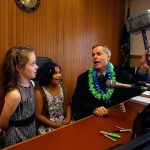 After finalizing their adoptions by Nick and Erin Schramm, Superior Court Judge, David A. Kurtz offers Kortnei, 9, and Miah, 8, a choice between striking the desk with a standard gavel or a super-sized gavel. Both went for the big silver one. (Dan Bates / The Herald)