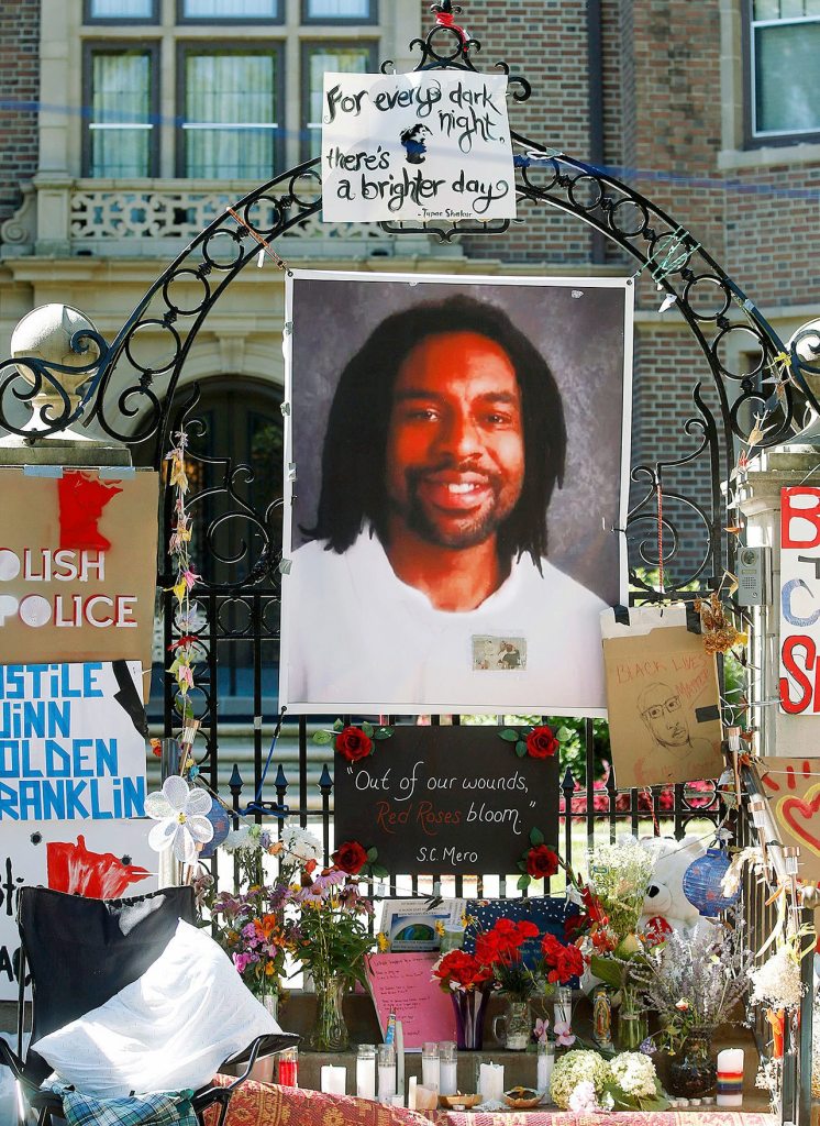In this July 25, 2016, photo, a memorial including a photo of Philando Castile adorns the gate to the governor&rsquo;s residence where protesters continue to demonstrate in St. Paul, Minnesota, against the July 6 shooting death of Castile by St. Anthony police officer Jeronimo Yanez during a traffic stop. (AP Photo/Jim Mone, File)
