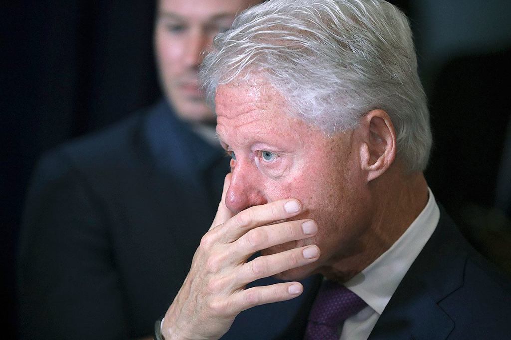 Former President Bill Clinton listens as his wife delivers her concession speech in New York on Wednesday, Nov. 9. (AP Photo/Andrew Harnik)