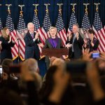 Hillary Clinton, accompanied by, from left, son-in-law Marc Mezvinsky, daughter Chelsea Clinton, husband Bill Clinton, vice presidential candidate Sen. Tim Kaine, D-Va., and Kaine&rsquo;s wife Anne Holton, speaks in New York on Wednesday, Nov. 9. (AP Photo/Matt Rourke)