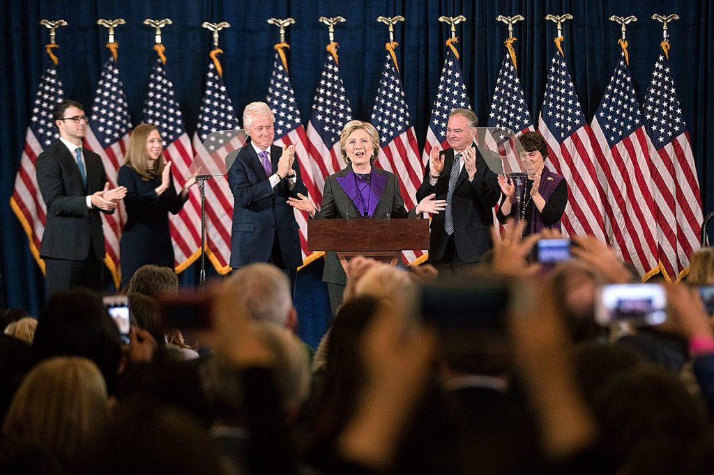 Hillary Clinton, accompanied by, from left, son-in-law Marc Mezvinsky, daughter Chelsea Clinton, husband Bill Clinton, vice presidential candidate Sen. Tim Kaine, D-Va., and Kaine&rsquo;s wife Anne Holton, speaks in New York on Wednesday, Nov. 9. (AP Photo/Matt Rourke)