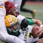 Archbishop Murphy&rsquo;s Abraham Lucas sacks Lynden&rsquo;s Jacob Hommes during a 2A state semifinal game Saturday afternoon at Everett Memorial Stadium. The Wildcats won 52-14. (Kevin Clark / The Herald)