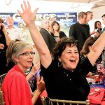 Republician supporters react to the numbers coming in at the Snohomish Event Center on Tuesday, Nov. 8. (Kevin Clark / The Herald)