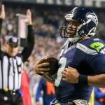 Seahawks quarterback Russell Wilson rushes for a touchdown in the first quarter of Seattle&rsquo;s 31-25 win over Buffalo on Monday night in Seattle. (Kevin Clark / The Herald)