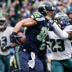 Seahawks tight end Jimmy Graham stiff arms Eagles safety Rodney McLeod in route to the end zone for a touchdown Sunday afternoon at CenturyLink Field in Seattle on November 20, 2016. (Kevin Clark / The Herald)