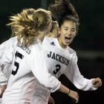 Jackson&rsquo;s Katie Cheng (3) celebrates with teammate Alyssa Weed after Cheng&rsquo;s goal during a district playoff match Thursday night at Everett Memorial Stadium. (Kevin Clark / The Herald)