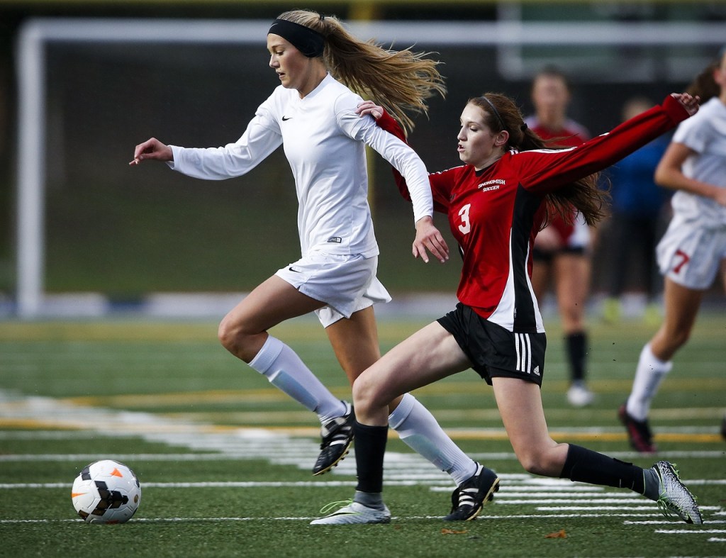 Snohomish&rsquo;s Mackenzie Green (right) tries to stop a charging Anna DePew of Stanwood during a district playoff game Tuesday at Shoreline Stadium. (Ian Terry / The Herald)
