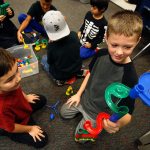 Third-graders Legacy Marshall (left) and Peyton Whitaker in Wynne Webster&rsquo;s class at Beverly Elementary School in Lynnwood test an educational marble tower they constructed while other students get started on similar tasks. (Dan Bates / The Herald)