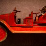 An old-time fire truck occupies a parking space in the Edmonds Historical Museum&rsquo;s &ldquo;Once Upon a Toy&rdquo; exhibit. (Dan Bates / The Herald)