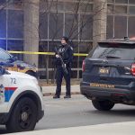 An officer blocks the scene as police respond to reports of an active shooter on campus at Ohio State University on Monday, Nov. 28, in Columbus, Ohio. (Tom Dodge/The Columbus Dispatch via AP)