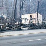 Burned out frames side-by-side utility vehicles sit at the side of the road in Gatlinburg, Tennessee, on Tuesday, Nov. 29. The fatal wildfires swept over the tourist town the night before, causing widespread damage. (AP Photo/Erik Schelzig)